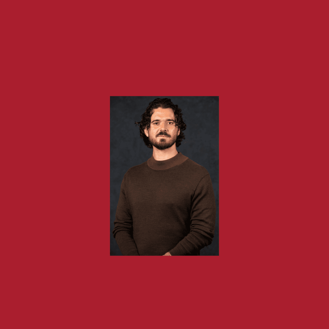Head shot of Michael McMahon against red background with Heritage Council logo