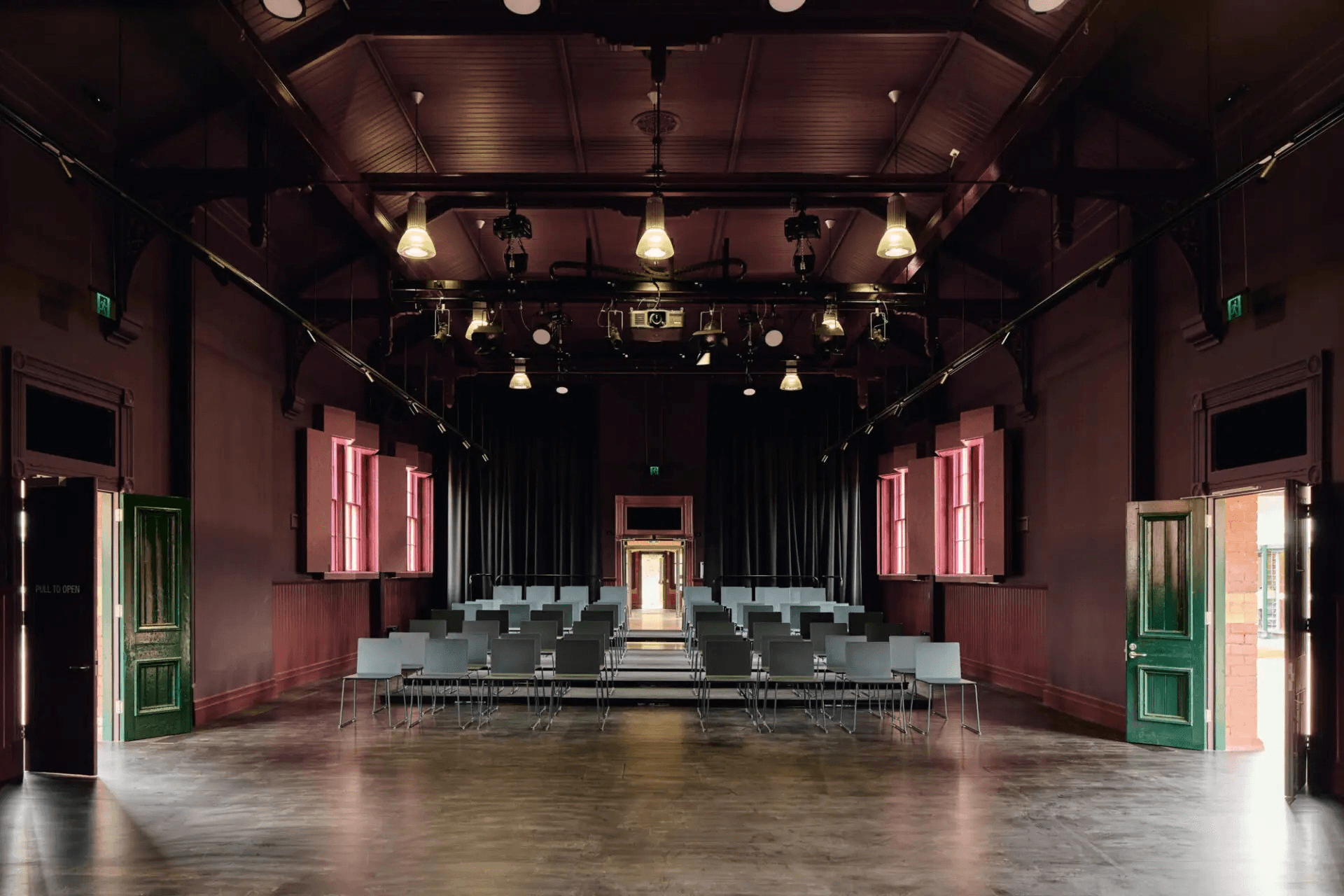 Converted old hall into performance space hosting modern lighting and seating